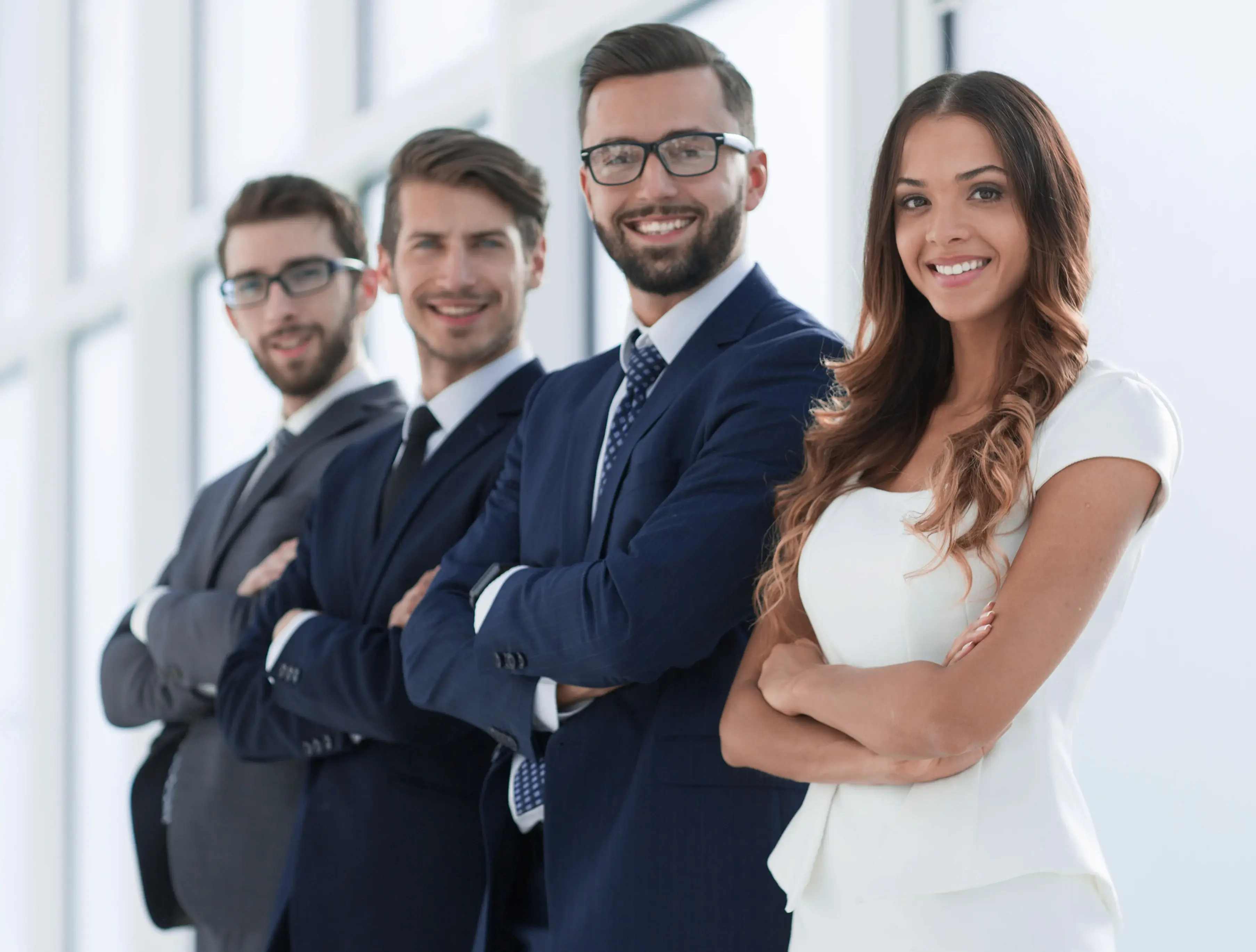 successful-business-team-standing-bright-office-1